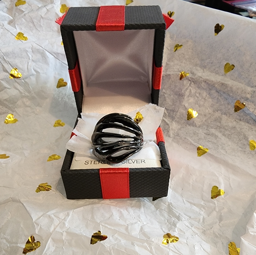 This is quite the modernistic design with a black coating over silver